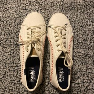 keds white  women shoes with red stitching on the side